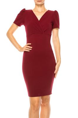 Solid, sheath dress with deep v-neckline and puff sleeves.