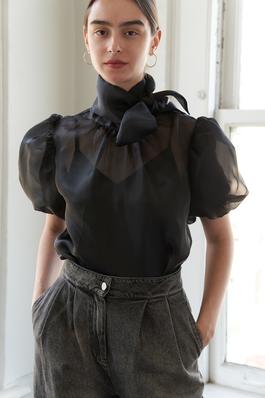 A solid woven organza blouse