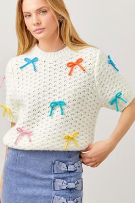 Sweater Knit Top With Multi Color Crochet Bow