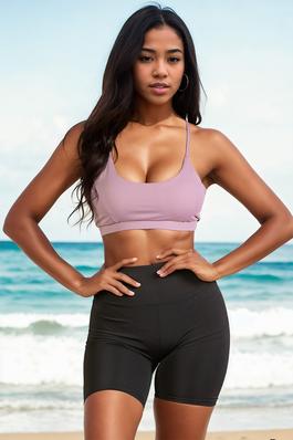 A polyamide elastane solid sports bra top featuring a racerback cutout back from Capella Apparel