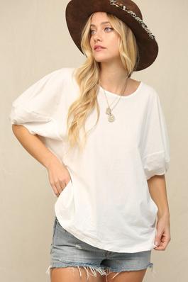 RELAXED,SLIGHTLY OVERSIZED FIT TOP.