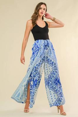 A printed woven pant featuring open side