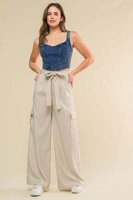 A woven pant featuring front closure and pleats